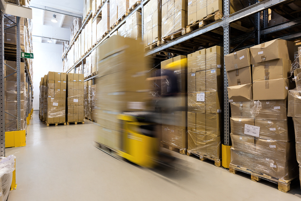 Fork lift operator preparing products for shipment